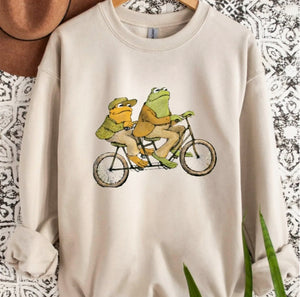 Frog & Toad Riding A Bicycle Crewneck Sweatshirt