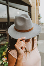 Fashion hat with buckle around brim